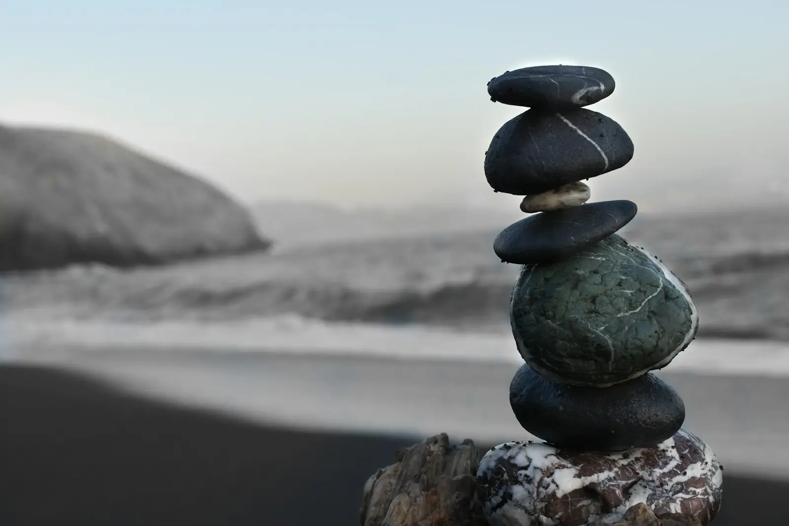 A stack of smooth stones on a beach